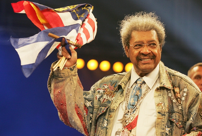 US boxing promoter Don King waves a US f